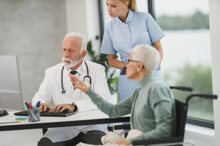 Doctor consulting patient clinic — Clinic & Dental, Lahore